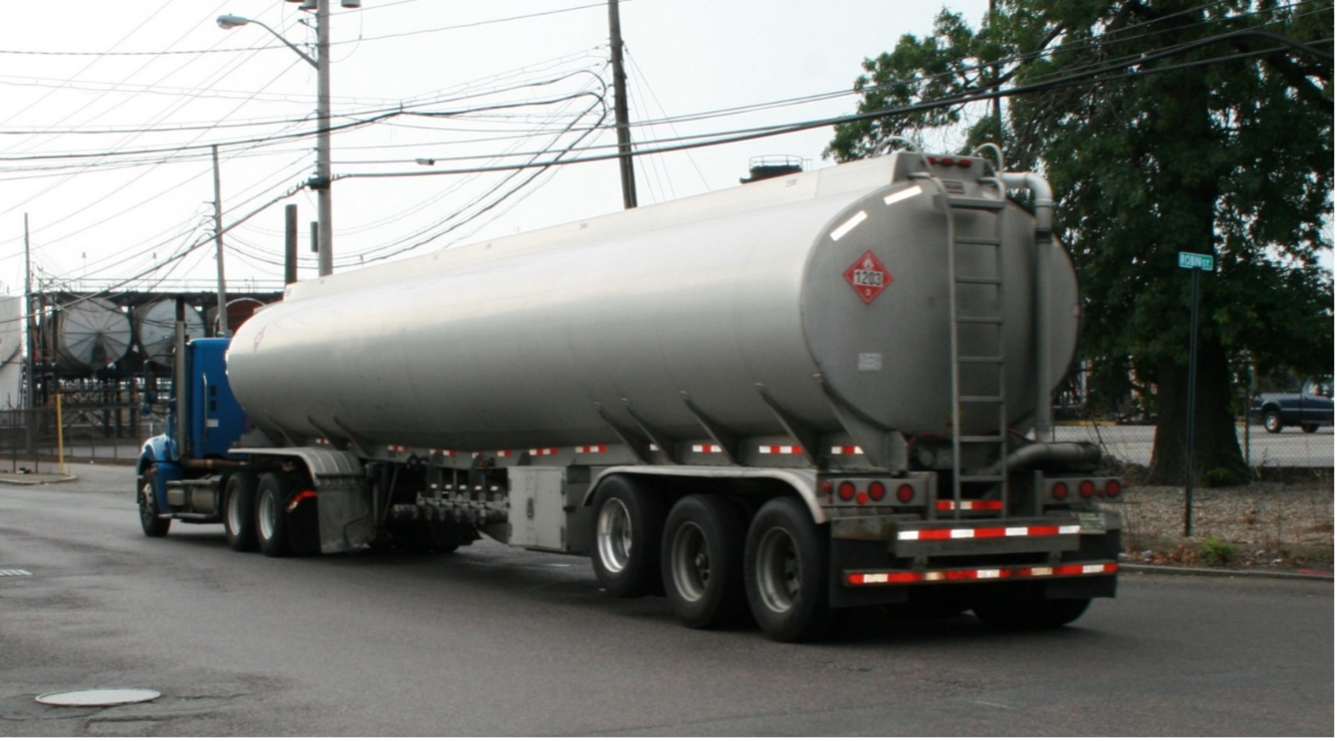 This figure shows two images of semi-trailers with hazardous cargoes. The first carries gasoline and the second carries liquefied natural gas. 1 of 2.